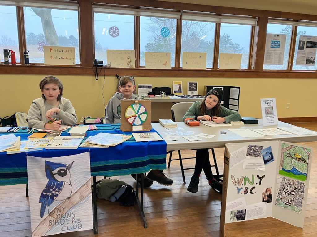 Kids sitting at A WNY YBC table